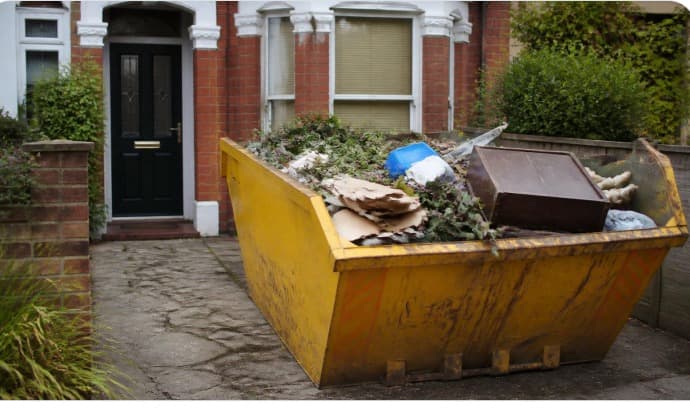 Yellow skip on a residential driveway